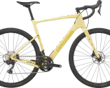 Żółty rower gravelowy Cannondale Topstone Carbon 3 z napędem Shimano GRX, gotowy na każdą przygodę.