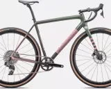 Gravelowy rower z gradientowym malowaniem. Widoczne nazwy części roweru: kierownica, siodełko, rama, koła Roval, opony Terra, przerzutka, korba Rival.